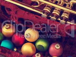 Colorful Christmas baubles with an old trumpet