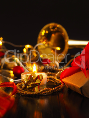 First candle burning with golden decoration
