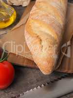 Organic baguette bread on a wooden table