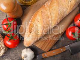 Organic baguette bread on a wooden table