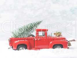 Red vintage truck with Christmas tree