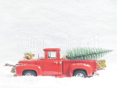 Red vintage truck with a Christmas tree