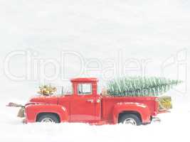 Red vintage truck with a Christmas tree