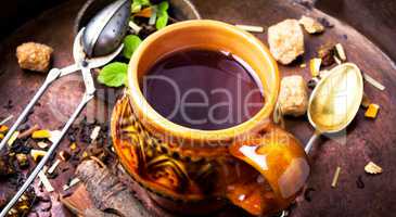 Green tea cup with tea leaves