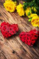 Spring flowers and symbolic red hearts