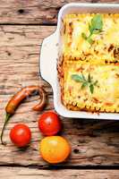 Homemade lasagna on wooden table