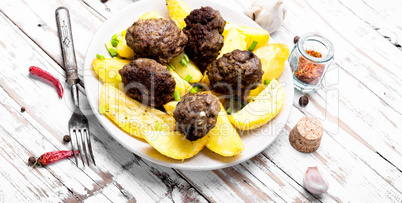 Meat balls with baked potatoes