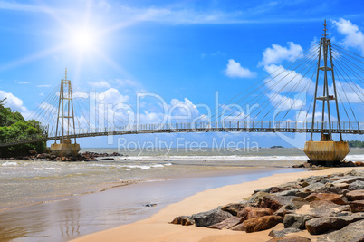 Bridge to island, ocean and sun in blue sky (Matara, Sri Lanka)