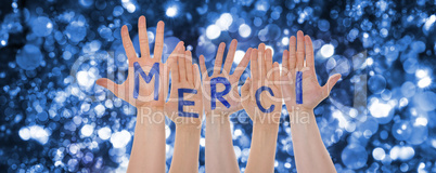 Hands Building Merci Means Thank You, Glittering Bokeh Background