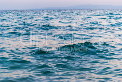 Surface texture of the Aegean sea. Small sea waves