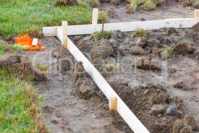 Guides and Stakes In Ground At Construction Site