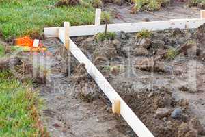 Guides and Stakes In Ground At Construction Site