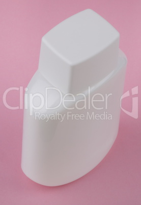 perfumery bottle on pink background