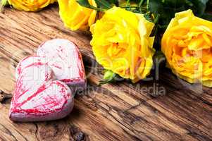 Symbolic wooden heart and flowers