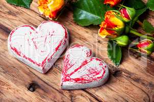 Symbolic wooden heart and flowers