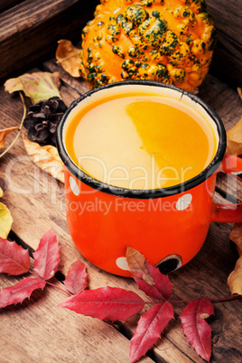 Pumpkin smoothie on rustic table