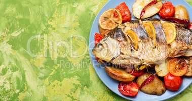 Fish baked with vegetable garnish