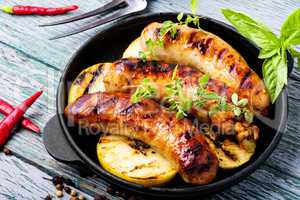 Grilled sausages in frying pan