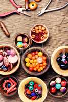 Colorful beads in wooden bowls