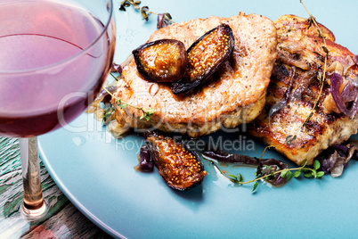 Meat steak with figs on the plate