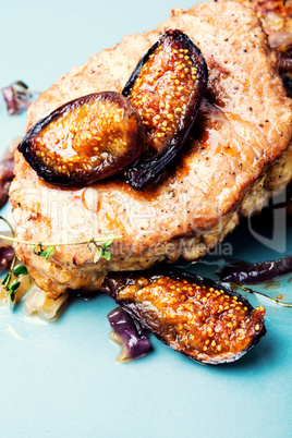 Grilled pork with fig on plate