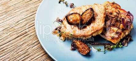 Meat steak with figs on the plate