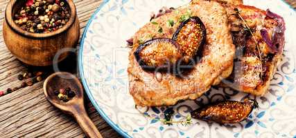Meat steak with figs on plate