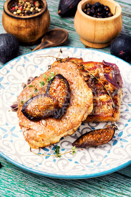 Meat steak with figs on plate
