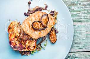 Meat steak with figs on plate