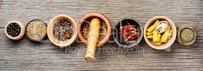 Different spices in bowls on table