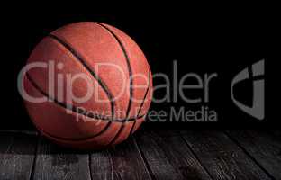 Basketball ball on a wooden floor