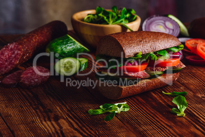 Sandwich with Salami and Fresh Vegetables