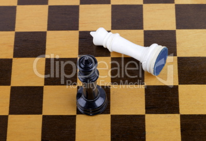 wooden checkerboard with figures