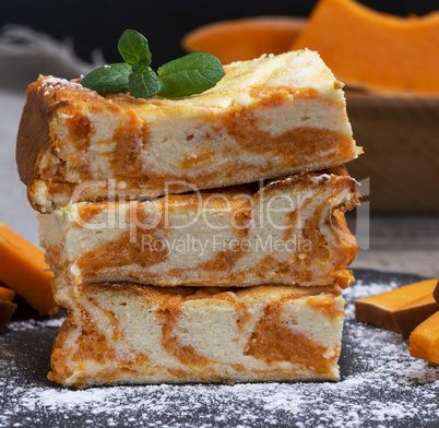 stack of square pieces of cheesecake with pumpkin