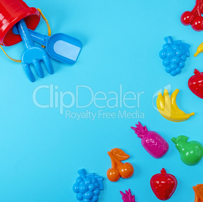Blue background with childrens colorful toys
