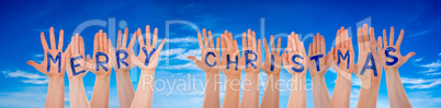 Many Hands Building Word Merry Christmas, Blue Sky