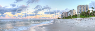 Sunrise over the white sand of Vanderbilt Beach in Naples