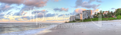 Sunrise over the white sand of Vanderbilt Beach in Naples