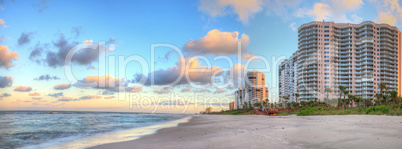 Sunrise over the white sand of Vanderbilt Beach in Naples