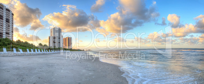 Sunrise over the white sand of Vanderbilt Beach in Naples