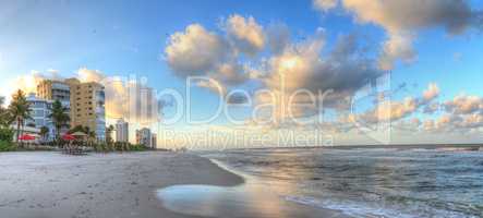 Sunrise over the white sand of Vanderbilt Beach in Naples
