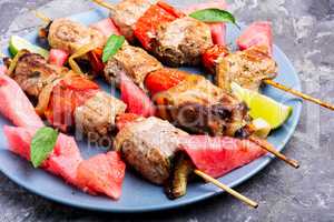 Shish kebab with watermelon garnish