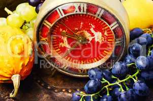 Beautiful autumn harvest and clock