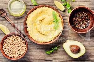 Hummus on rustic wooden table