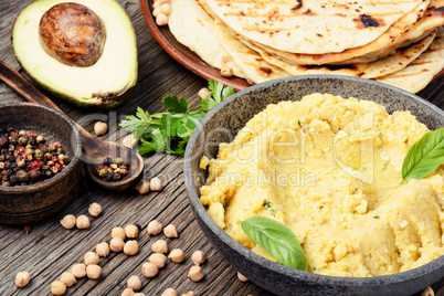 Hummus on rustic wooden table