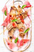 Shish kebab with watermelon garnish