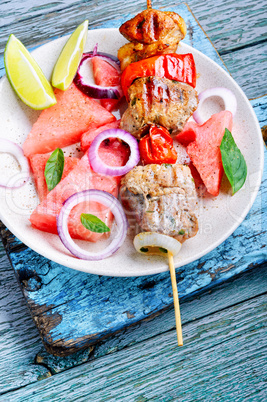 Shish kebab with watermelon garnish