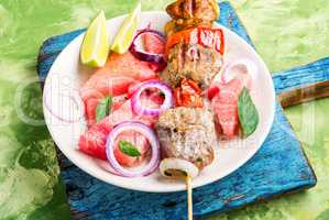 Shish kebab with watermelon garnish