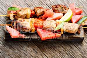 Shish kebab with watermelon garnish