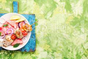 Shish kebab with watermelon garnish